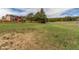Expansive yard with plenty of space for outdoor activities and views of a home with a deck at 19855 Draco Dr, Monument, CO 80132