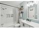 Charming bathroom showcases tiled shower and tub with modern fixtures, paired with trendy décor at 2355 E Geddes Ave # C24, Littleton, CO 80122