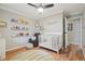 Calm Bedroom with light-colored walls, built in shelves, and wooden floors with a patterned rug at 2355 E Geddes Ave # C24, Littleton, CO 80122