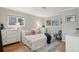 Bright bedroom with modern decor and ample natural light from dual windows at 2355 E Geddes Ave # C24, Littleton, CO 80122