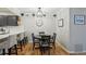 The dining area is adjacent to the kitchen and features an elegant light fixture at 2355 E Geddes Ave # C24, Littleton, CO 80122