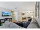 Spacious living room featuring comfortable seating, TV, and seamless flow into the dining area at 2355 E Geddes Ave # C24, Littleton, CO 80122