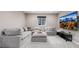 A large sectional sofa is in this basement living room, perfect for watching TV at 3059 Morningbird Ln, Castle Rock, CO 80109