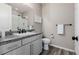 Bathroom featuring a walk-in shower, granite countertop, vanity, and a white framed mirror, providing comfort at 3059 Morningbird Ln, Castle Rock, CO 80109