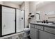 Modern full bathroom features a glass enclosed shower, sink, and granite countertops at 3059 Morningbird Ln, Castle Rock, CO 80109