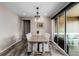 Elegant dining room with stylish furniture, sliding glass doors, and great natural light at 3059 Morningbird Ln, Castle Rock, CO 80109