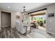 Elegant dining room with stylish furniture, sliding glass doors leading to a patio at 3059 Morningbird Ln, Castle Rock, CO 80109