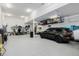 A spacious three-car garage with overhead storage and epoxy floor at 3059 Morningbird Ln, Castle Rock, CO 80109