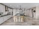 Modern kitchen with stainless appliances, center island, and stylish pendant lighting at 3059 Morningbird Ln, Castle Rock, CO 80109