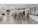 Spacious kitchen with modern appliances, a center island with seating and lots of natural light at 3059 Morningbird Ln, Castle Rock, CO 80109