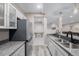 Basement kitchenette with stainless steel appliances and granite countertops at 3059 Morningbird Ln, Castle Rock, CO 80109