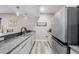 Kitchenette featuring granite countertops and stainless steel appliances at 3059 Morningbird Ln, Castle Rock, CO 80109