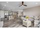 Open concept living area with modern kitchen, spacious seating, and neutral décor at 3059 Morningbird Ln, Castle Rock, CO 80109
