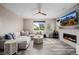 Spacious living room features a large sectional sofa, modern fireplace, and bright windows at 3059 Morningbird Ln, Castle Rock, CO 80109