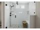 Glass shower with a tiled surround, and black fixtures at 3059 Morningbird Ln, Castle Rock, CO 80109