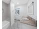 Bright bathroom features a marble countertop, tiled floors, and a walk-in shower at 7883 Fox Creek Trl, Franktown, CO 80116