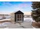 Charming exterior view of a modern shed with large windows and a glass door at 7883 Fox Creek Trl, Franktown, CO 80116
