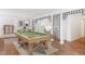 Game room featuring a pool table, terracotta tile floors, and a decorative partition at 7883 Fox Creek Trl, Franktown, CO 80116