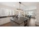 Bright kitchen featuring a large island with bar seating, granite counters and stainless steel appliances at 7883 Fox Creek Trl, Franktown, CO 80116