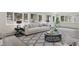 Bright living room with a large sofa, patterned rug and views of outside trees at 7883 Fox Creek Trl, Franktown, CO 80116