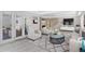 Spacious living room with comfortable seating, fireplace, and walk-out to lanai at 7883 Fox Creek Trl, Franktown, CO 80116
