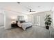 Spacious main bedroom featuring neutral colors, walk-out, tray ceilings and large windows at 7883 Fox Creek Trl, Franktown, CO 80116