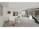 Cozy sunroom with large windows and comfortable seating provides a peaceful retreat at 7883 Fox Creek Trl, Franktown, CO 80116