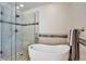 Luxurious bathroom featuring a modern bathtub and separate glass shower at 7472 S Memphis St, Aurora, CO 80016