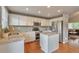 Bright kitchen with white cabinets, granite countertops, and stainless steel appliances for a modern look at 7472 S Memphis St, Aurora, CO 80016