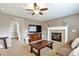 Comfortable living room with a fireplace, media console, and open layout at 7472 S Memphis St, Aurora, CO 80016