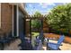 Inviting backyard patio with stone pavers, string lights, and comfortable seating at 10109 E 28Th Ave, Denver, CO 80238