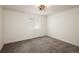 Finished basement with carpet flooring and a window at 10109 E 28Th Ave, Denver, CO 80238