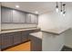 Finished basement with cabinets and a bar area at 10109 E 28Th Ave, Denver, CO 80238