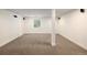Finished basement with carpet flooring, speakers, and a window at 10109 E 28Th Ave, Denver, CO 80238