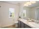 Bright bathroom featuring double sinks and a shower at 10109 E 28Th Ave, Denver, CO 80238