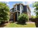 Exterior elevation features a brick patio, a pergola and lush landscaping at 10109 E 28Th Ave, Denver, CO 80238