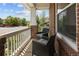 Relaxing front porch featuring comfortable seating with floral patterned pillows and charming neighborhood views at 10109 E 28Th Ave, Denver, CO 80238