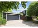 View of the garage with driveway at 10109 E 28Th Ave, Denver, CO 80238