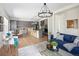 Spacious open-concept living area with modern kitchen, dining, and lounge spaces at 10109 E 28Th Ave, Denver, CO 80238