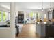 Open-concept living space with hardwood floors, modern fixtures, and comfortable furnishings at 10109 E 28Th Ave, Denver, CO 80238