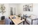 Home office with a desk, French doors, stylish décor and natural lighting at 10109 E 28Th Ave, Denver, CO 80238