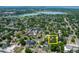 Stunning aerial view of property with mature trees and close proximity to a beautiful lake at 2217 King St, Denver, CO 80211
