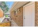 This backyard features a brick exterior and a wooden fence at 2217 King St, Denver, CO 80211