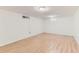 Finished basement area featuring light wood flooring and ample natural light at 2217 King St, Denver, CO 80211
