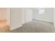 Spacious room with neutral carpet, white walls, and built-in closet at 2217 King St, Denver, CO 80211