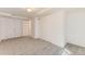 This bedroom features plush carpet, neutral paint and a full-sized wardrobe at 2217 King St, Denver, CO 80211