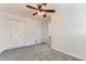 This bedroom features a ceiling fan, closet, neutral paint, and plush carpet at 2217 King St, Denver, CO 80211