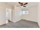 Bright bedroom with neutral walls, carpeted floor, and a ceiling fan offering a comfortable and inviting atmosphere at 2217 King St, Denver, CO 80211