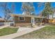 Charming brick home featuring a well-maintained lawn and lovely curb appeal at 2217 King St, Denver, CO 80211