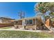 Quaint brick home with a well-kept yard and charming architectural details at 2217 King St, Denver, CO 80211